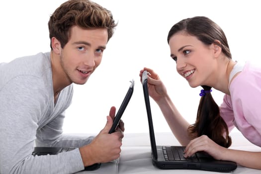 Two students with laptops