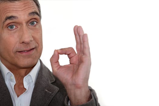 Man making a gesture of satisfaction with the fingers