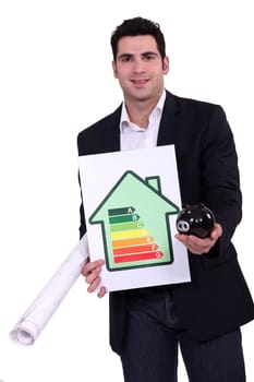 Man with energy rating sign  and piggy bank