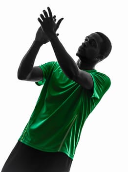 one african man soccer player applauding green jersey in silhouette  on white background