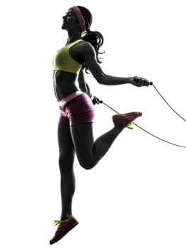 one caucasian woman exercising fitness  jumping rope  in silhouette on white background