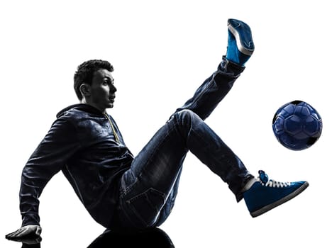 one caucasian young man soccer freestyler player  in silhouette  on white background