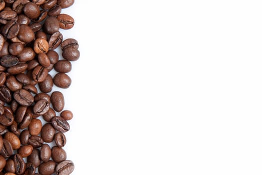 Coffee beans on a white background with a copy space.