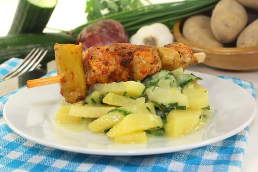 Potato-cucumber salad with a fiery skewer