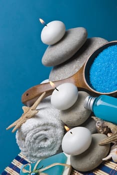 Spa background with blue hygiene items and toiletries.