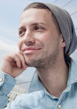 Close-up of the happy and cheerful young man outdoors