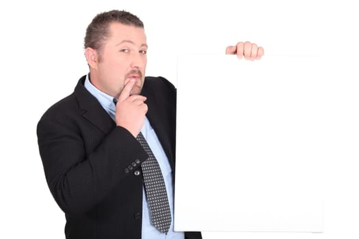 Perplexed man with white sign