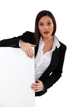 Businesswoman with a board left blank for your message