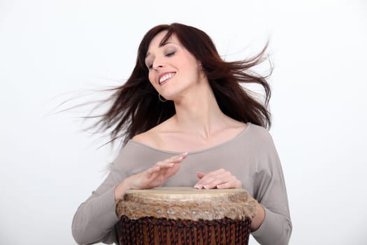 Woman playing bongo