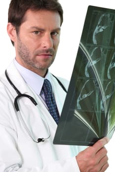 Doctor examining an x-ray
