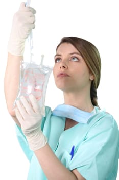 Female nurse administering a drip