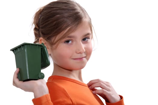 Girl holding mini recycling bin