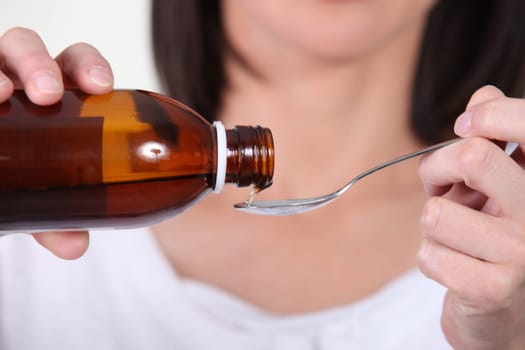 close shot of syrup being poured by woman