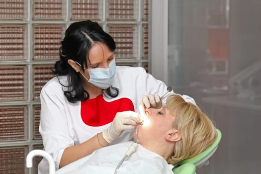 Female patient in chair at dentist office