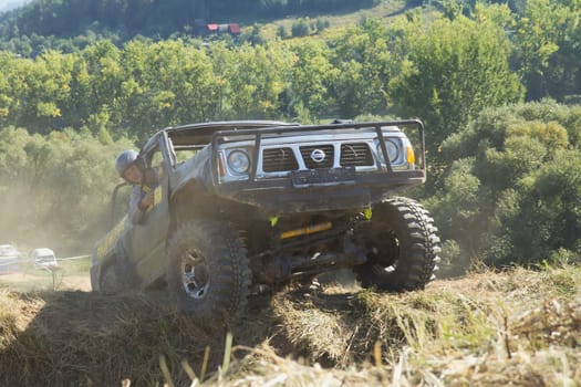 RAPOTIN, CZECH REPUBLIC - SEPT 07. Off-road cars on a trial race in the "BIG SHOCK CUP Trial 2013"" on September 07, 2013 near the village Rapotin, Czech Republic."