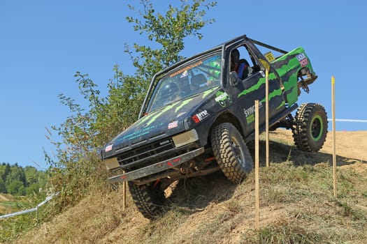RAPOTIN, CZECH REPUBLIC - SEPT 07. Off-road cars on a trial race in the "BIG SHOCK CUP Trial 2013"" on September 07, 2013 near the village Rapotin, Czech Republic."