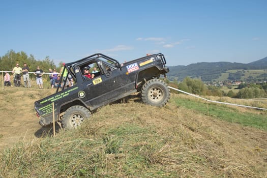 RAPOTIN, CZECH REPUBLIC - SEPT 07. Off-road cars on a trial race in the "BIG SHOCK CUP Trial 2013"" on September 07, 2013 near the village Rapotin, Czech Republic."