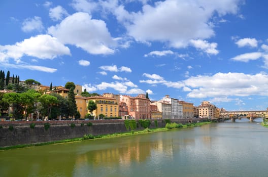 Picturesque view on colorful Ponte Vecchio over Arno River in Florence, Italy