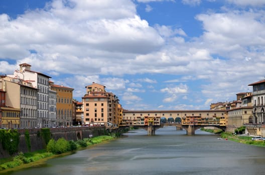 Picturesque view on colorful Ponte Vecchio over Arno River in Florence, Italy