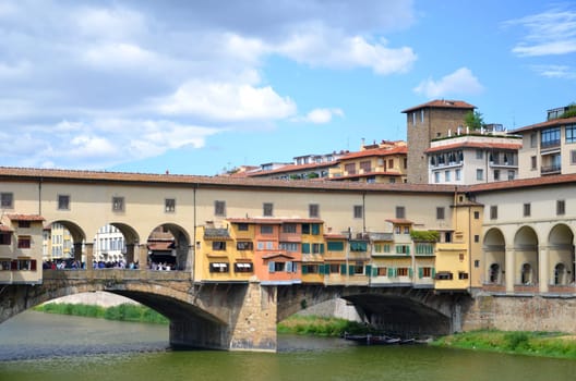 Picturesque view on colorful Ponte Vecchio over Arno River in Florence, Italy