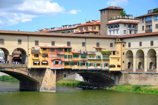 Picturesque view on colorful Ponte Vecchio over Arno River in Florence, Italy