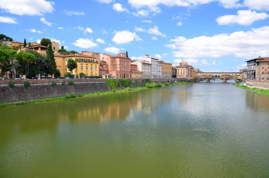 Picturesque view on colorful Ponte Vecchio over Arno River in Florence, Italy