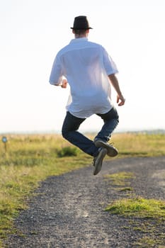 Young man jumps for joy