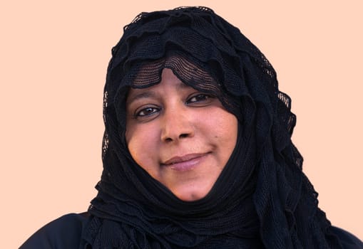 Amal with veil and with a quiet melancholic smile