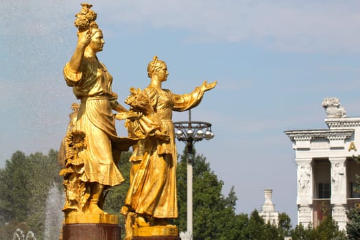 Girl with a fountain of friendship of peoples, Ukraine and Russia