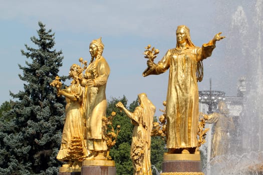 Girl with a fountain of friendship of the peoples of Tajikistan and Turkmenistan