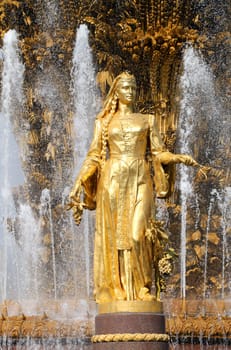 Girl with a fountain of friendship of peoples Georgia