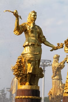 Girl with a fountain of friendship of the peoples of Belarus