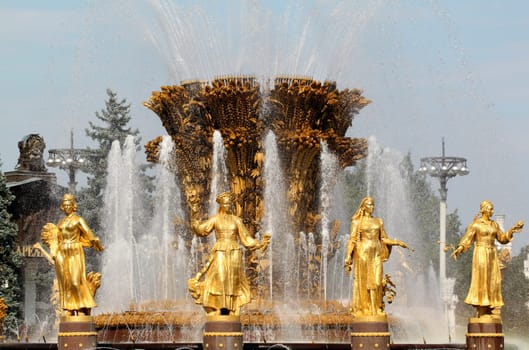 Girl with Fountain of Friendship of Peoples in Moscow on vdnh