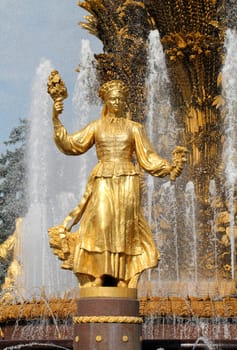 Girl with a fountain of friendship of peoples Lithuania in Moscow at ENEA