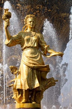 Girl with a fountain of friendship of peoples Ukraine