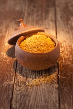 Earthenware pot of bulgur wheat, a form of cracked or dried crushed wheat granules or grains used in Middle Eastern cuisine