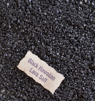 Background texture of Black Hawaiian Lava Salt, a sea salt made from volcanic lava sea water and blended with deactivated charcoal , used as a spice and condiment in cooking