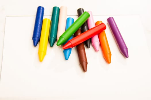 Painting with crayons .