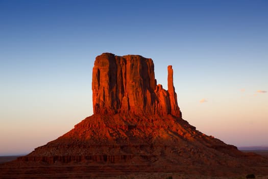 Monument Valley West Mitten at sunset blue sky Utah