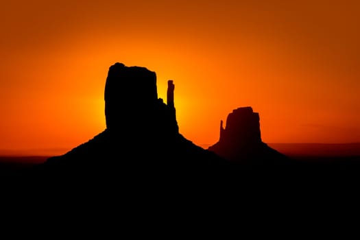 Sunrise at Monument Valley West and East Mittens Butte Utah National Park