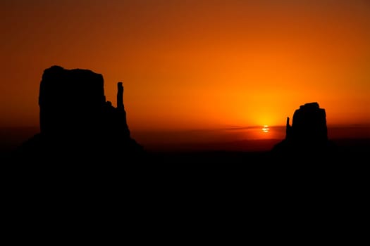 Sunrise at Monument Valley West and East Mittens Butte Utah National Park