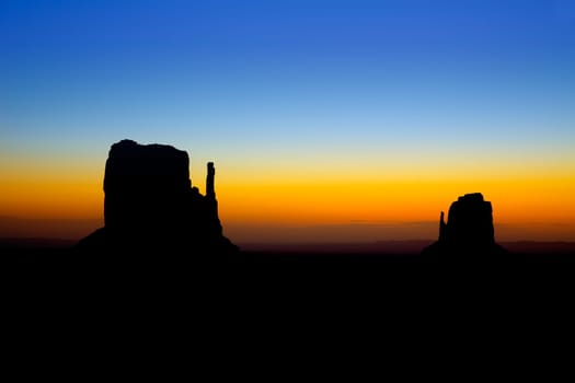 Sunrise at Monument Valley West and East Mittens Butte Utah National Park
