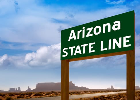 Road sign between Utah and Arizona State Line in Monument Valley