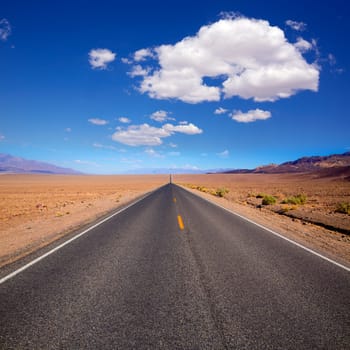 Badwater road Death Valley straight in desert to mountains National Park California