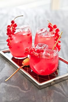 Cold bowl in three glasses with fresh red currants
