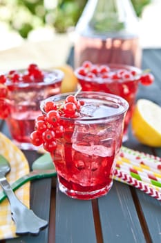 Fresh lemonade with fresh red currants and ice cream
