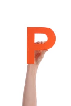 A Hand Holds a Orange P, Isolated