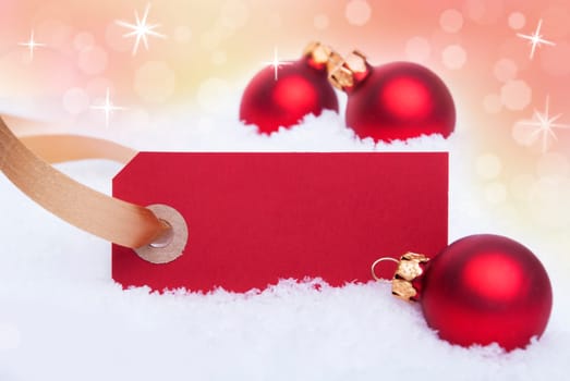 A Red Label in the Snow as Christmas Background With Copy Space
