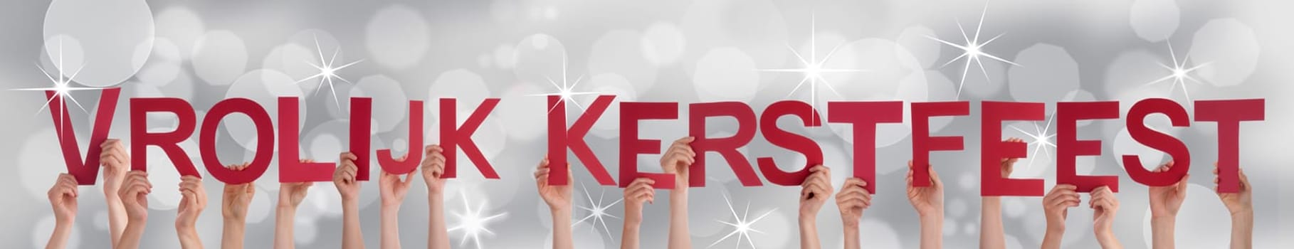 Many People Holding the Dutch Words Vrolijk Kerstfeest Which Means Merry Christmas on a Silver Background