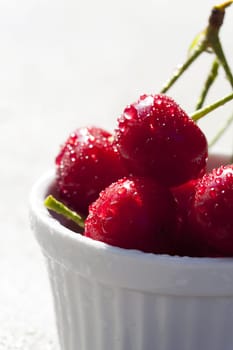 Fresh cherries with water drops in shell
